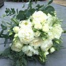 Scented bouquet of white peonies, ivory roses, and lisianthus