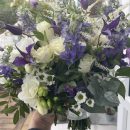 violet/ blue clematis, roses, white daisies and fluffy astilbe bridal bouquet