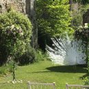 Amberley Castle; Our tall freestanding candelabra decked with blooms compete with the stunning peacock!